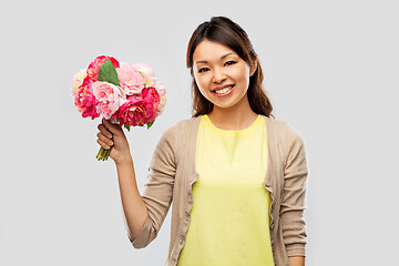 Image showing happy asian woman with bunch of flowers