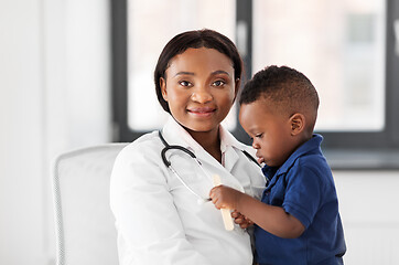 Image showing doctor or pediatrician with baby patient at clinic