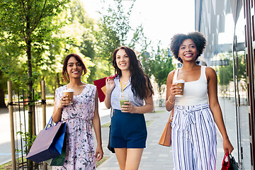 Image showing women with shopping bags and drinks in city