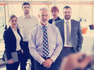 Image showing senior business man with his team at office