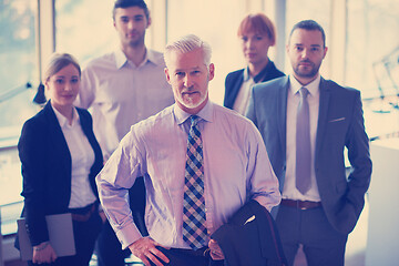 Image showing senior business man with his team at office