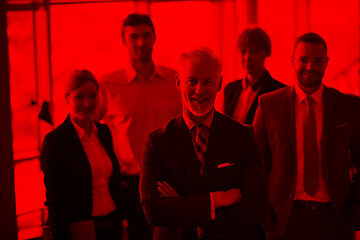 Image showing senior business man with his team at office