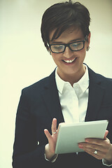 Image showing business woman working on tablet