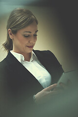 Image showing business woman working on tablet