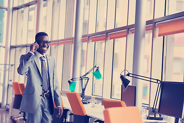 Image showing African American businessman talk by phone