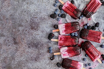 Image showing Homemade blackberry and cream ice-creams or popsicles with frozen berries