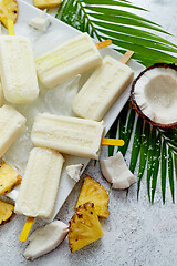 Image showing Homemade vegan popsicles made with coconut milk and pineapple. Delicious healthy summer snack