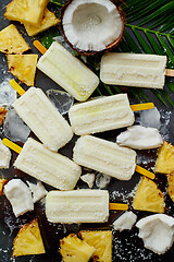 Image showing Summer popsicles on stick. Pinacolada flavour. Made with pineapple, cocount milk, rum. Vegan snack