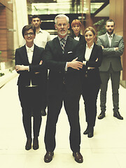 Image showing senior business man with his team at office