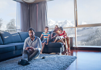 Image showing Happy family playing a video game