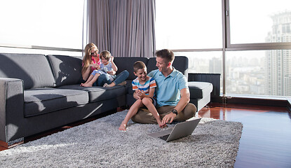 Image showing Happy family playing a video game