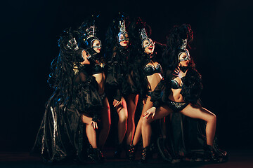 Image showing young beautiful dancers posing on studio background