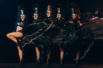 Image showing young beautiful dancers posing on studio background