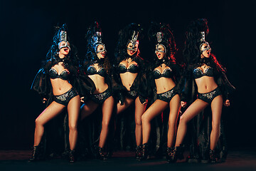 Image showing young beautiful dancers posing on studio background