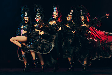 Image showing young beautiful dancers posing on studio background