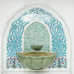 Image showing Tiled ornament drinking water fountains on forecourt of islamic mosque