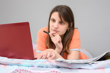 Image showing Girl looking for work on online sites on the Internet