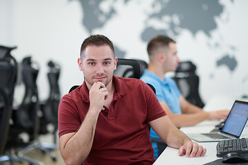 Image showing two male software developers working on computer