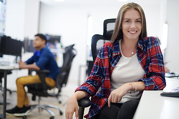 Image showing casual business woman working on desktop computer