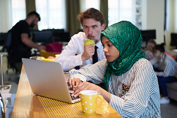 Image showing international multicultural business team working together on la