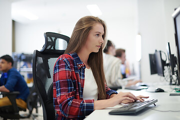 Image showing casual business woman working on desktop computer
