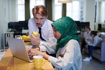 Image showing international multicultural business team working together on la