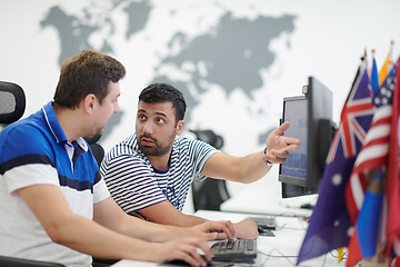 Image showing two male software developers working on computer