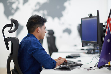 Image showing casual indian business man working on desktop computer