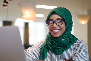 Image showing african muslim business woman working on laptop computer