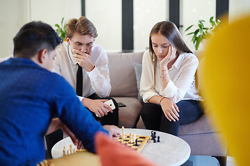 Image showing multiethnic group of business people playing chess