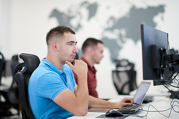 Image showing two male software developers working on computer