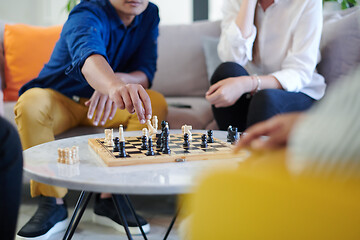 Image showing multiethnic group of business people playing chess