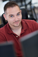 Image showing casual business man working on desktop computer