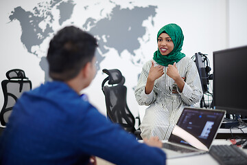 Image showing Multiethnic startup business team with Arabian woman