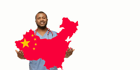 Image showing Beautiful african-american doctor cares about China isolated over white studio background