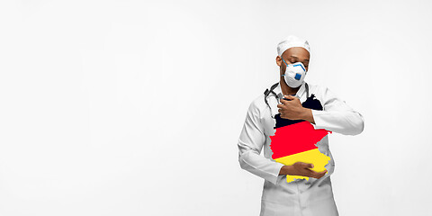 Image showing Beautiful african-american doctor cares about Germany isolated over white studio background