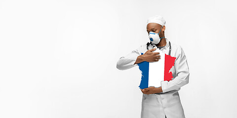 Image showing Beautiful african-american doctor cares about France isolated over white studio background