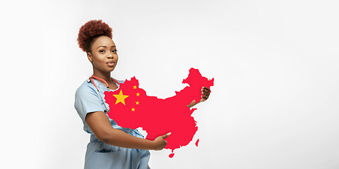 Image showing Beautiful african-american doctor cares about China isolated over white studio background