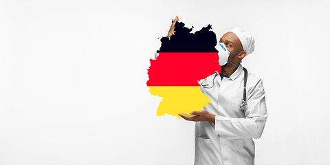 Image showing Beautiful african-american doctor cares about Germany isolated over white studio background