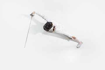 Image showing Teen girl in fencing costume with sword in hand isolated on white background, top view