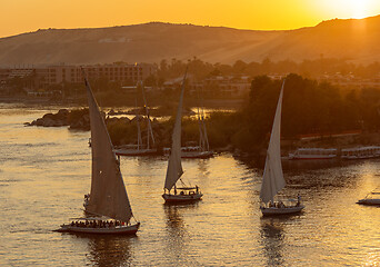 Image showing felucca boats on Nile river  at sunset