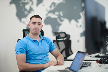 Image showing casual business man working on desktop computer