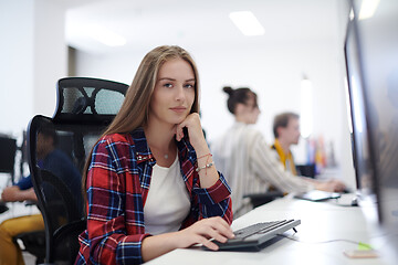 Image showing casual business woman working on desktop computer