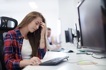 Image showing tired casual business woman taking a break from work