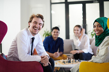 Image showing multiethnic group of business people playing chess