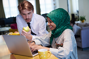 Image showing international multicultural business team working together on la