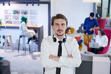 Image showing portrait of successful businessman  in startup office