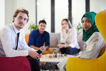 Image showing multiethnic group of business people playing chess