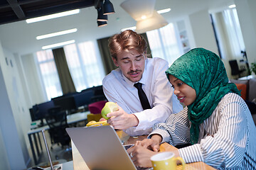 Image showing international multicultural business team working together on la