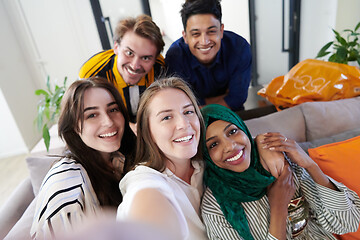 Image showing group of casual multiethnic business people taking selfie